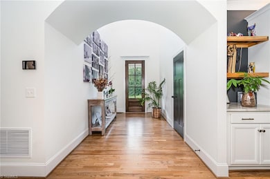 Foyer (looking through the arched doorway to the front door)