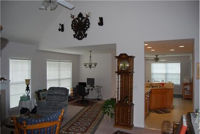 Vaulted Great room with Openings to Kitchen, Breakfast, and Dining which leads out to the Wonderful Covered Patio
