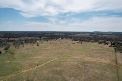 Birds eye view of property with a rural view