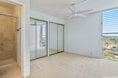 Master bedroom with jalousie windows for natural c