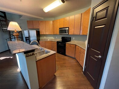 Kitchen with stainless steel appliances, a sink, 