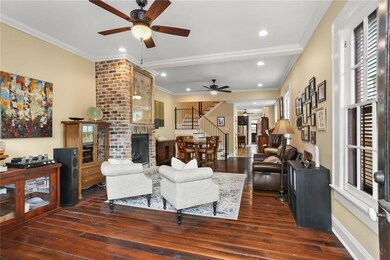 Living room facing kitchen, courtyard and pool.