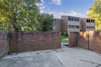 Gate featuring a patio area