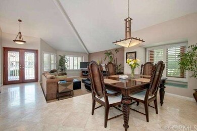 Formal dining room open to the formal living room 