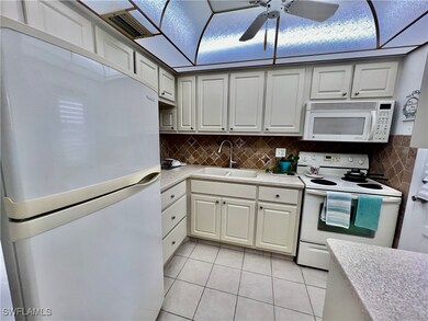 Kitchen with solid surface countertops and stone t