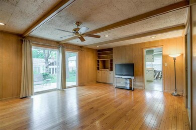 Spacious family room with hardwoods and built ins