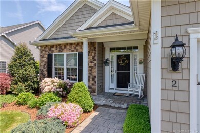 An expanded front porch features an architectural column and room for a chair, so you can relax and greet the neighbors.