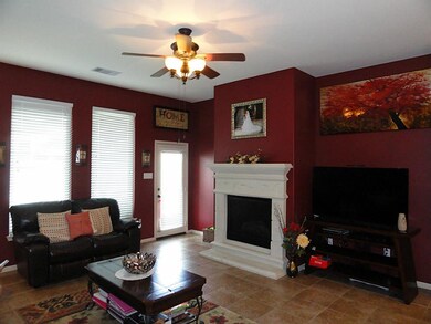 Tiled family room w/cast stone gas fireplace
