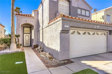 View of front of house with stucco siding, an atta