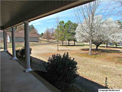 A covered front porch welcomes you and your guests