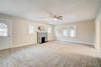 This really is a very large living area.  It would look so lovely split into two distinct areas separated by a sofa or another piece from your collection.  Inviting, charming, cozy and roomy all wrapped into one room.