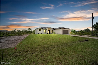 View of front of property with driveway, an attach