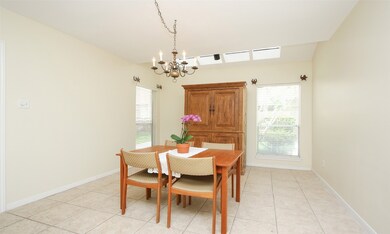 spacious dining room with a serving window/bar from kitchen