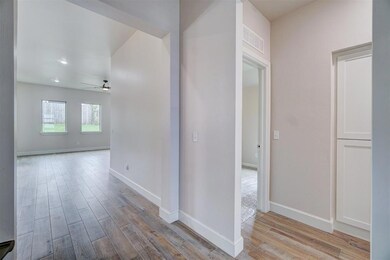 Corridor featuring light hardwood / wood-style flo