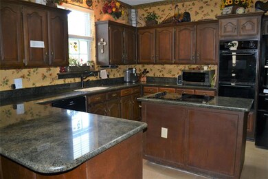 Kitchen with granite countertops
