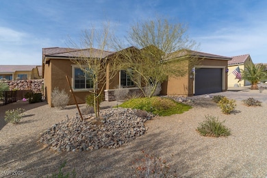 Single story home featuring driveway, a tile roof,