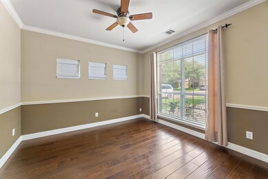 Spare room with hardwood / wood-style floors, a c