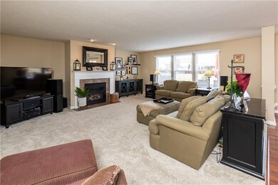 Spacious and bright Great Room features cozy gas fireplace!