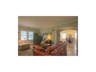 View of living room, entry hall and dining room. C