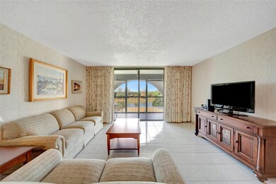 Spacious Living Room with Patio Doors to Screened