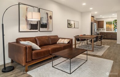 The living room opens to the dining room and the ktichen.