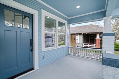 The charming covered front porch retains its tradi