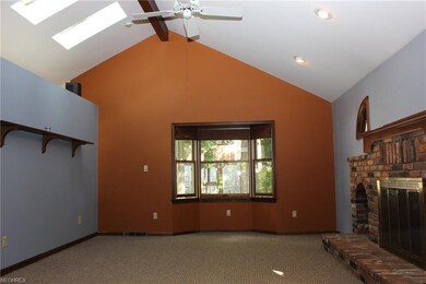 FAMILY ROOM WITH BRICK SURROUND AND HEARTH WOOD BU