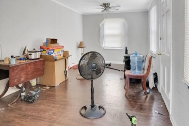 Misc room featuring crown molding, hardwood / wood