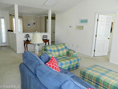 Living Room. Spacious floor plan with fresh neutral paint.
