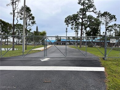 View of gate with a yard