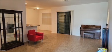 Living area featuring tile patterned flooring and
