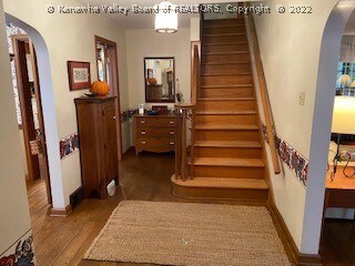 Inviting foyer with hardwood floors throughout