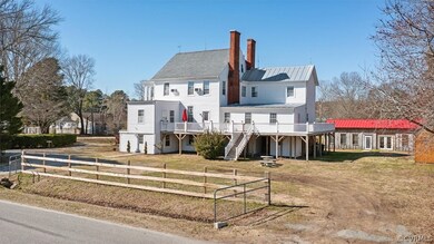 View of front facade featuring a wooden deck and a