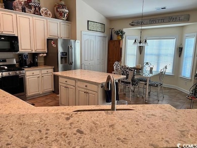 Kitchen with stainless steel appliances, lofted ce