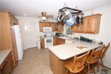 Kitchen with breakfast bar and writing desk. Pot r