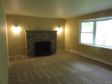 Living room with wood burning fireplace
