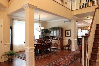 Upgraded wainscoting, two-step crown molding add a