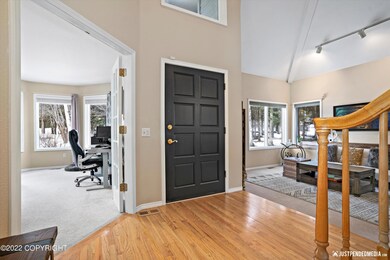 Vaulted Entry with hard wood floors