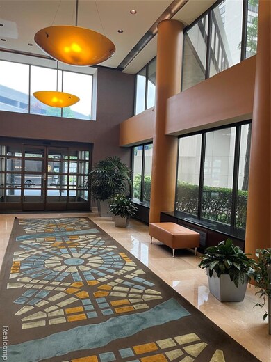 Lobby featuring a high ceiling and recessed lighting