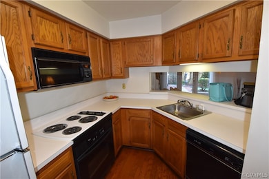 Spacious Kitchen including refrigerator and wood floors.