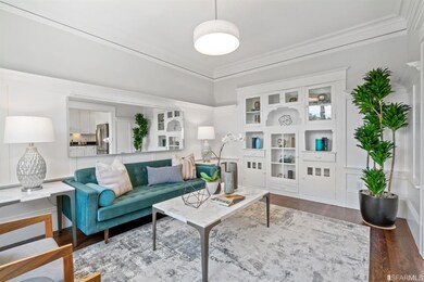 The living room features classic built-in cabinets
