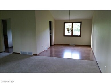 Dining area adjacent to the living room, new floor