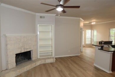 Unfurnished living room with a sink, a ceiling fa