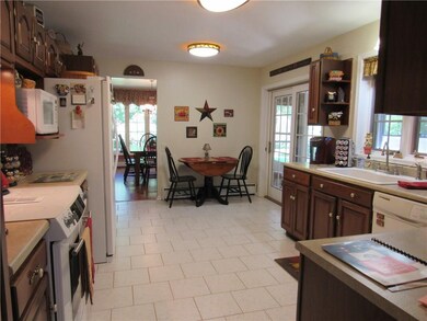 Cherry cabinetry, Jenn-Air Range, Sliding glass do