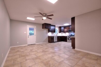 View of Dining Area and Kitchen.  Doorway leads to