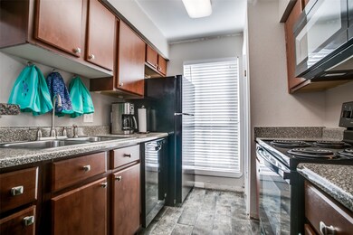 Kitchen with new refrigerator and all dishes and u