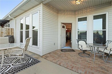Additional covered brick patio with overhead light