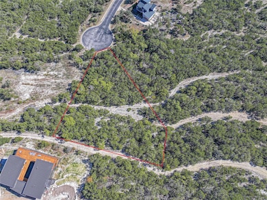 Aerial view of property and surrounding area with