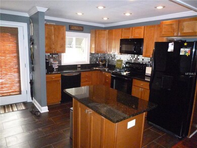 Modern Cabinets with granite counter tops and a me