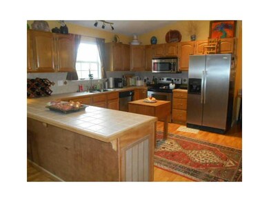 Kitchen. Lots of cabinets, tile counters, stainless steel appliances, double sink,  Eureka Springs;
